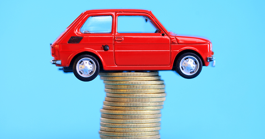 Miniature car on coin stack | The Blog